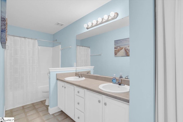30 Chalice Hill Ln, Travelers Rest, SC 29690 - bathroom with double vanity, toilet, shower / bath combo, and tile patterned floors