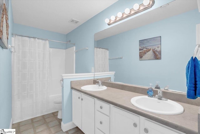30 Chalice Hill Ln, Travelers Rest, SC 29690 - full bathroom featuring double vanity, shower / bath combination with curtain, toilet, and tile patterned floors