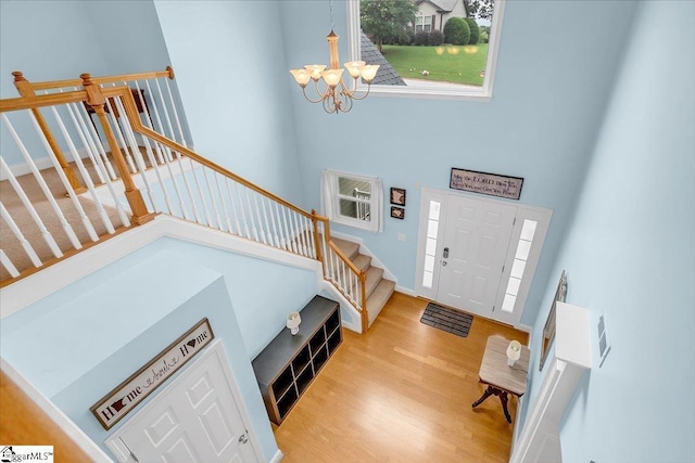 30 Chalice Hill Ln, Travelers Rest, SC 29690 - entrance foyer featuring a towering ceiling, stairs, a chandelier, and wood finished floors