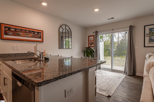 304 Oakmont Valley Trl, Seneca, SC 29678 - kitchen with a sink, stainless steel dishwasher, white cabinets, dark wood-type flooring, and dark stone counters