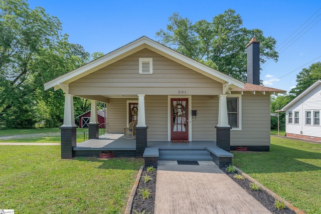 201 W Highland Ave, Anderson, SC 29625 - view of front facade featuring covered porch and a front lawn