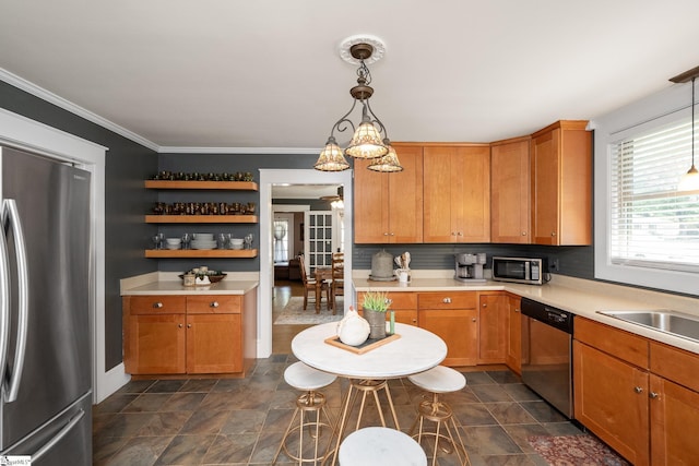 201 W Highland Ave, Anderson, SC 29625 - kitchen featuring stainless steel appliances, light countertops, pendant lighting, crown molding, and baseboards