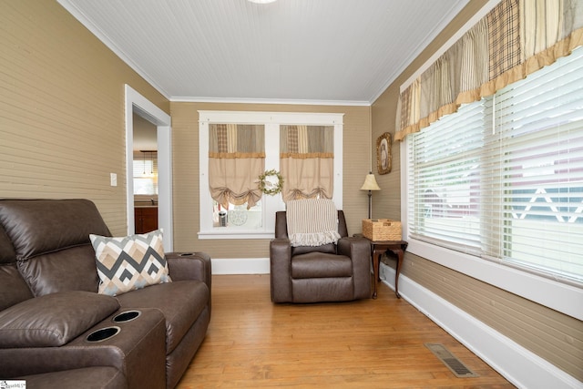 201 W Highland Ave, Anderson, SC 29625 - living area with ornamental molding, baseboards, and light wood-style floors