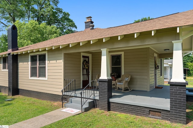 201 W Highland Ave, Anderson, SC 29625 - view of front of property featuring a porch, a chimney, and a front lawn