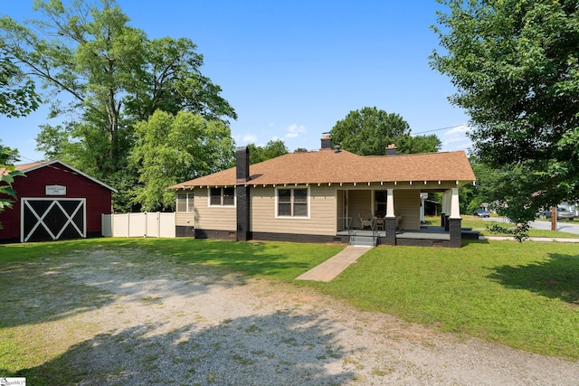 201 W Highland Ave, Anderson, SC 29625 - view of front of house featuring covered porch, a chimney, an outbuilding, and crawl space