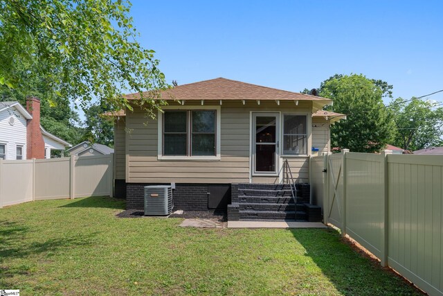 201 W Highland Ave, Anderson, SC 29625 - back of property with cooling unit, entry steps, and roof with shingles