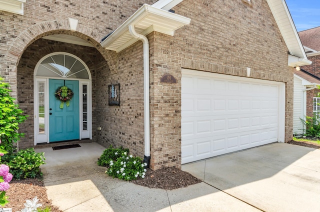 101 Peaks Ct, Taylors, SC 29687 - property entrance with a garage, concrete driveway, and brick siding