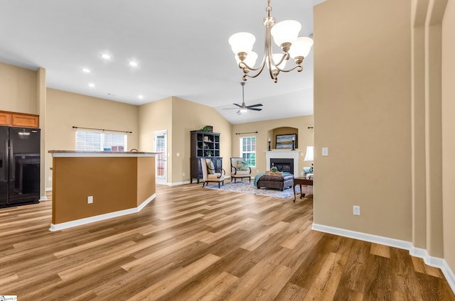 101 Peaks Ct, Taylors, SC 29687 - unfurnished living room featuring plenty of natural light, ceiling fan, light wood finished floors, a glass covered fireplace, and recessed lighting