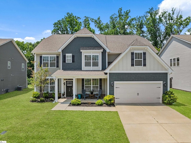 712 Paxton Rose Dr, Greer, SC 29650 - view of front of property featuring covered porch, concrete driveway, a front yard, an attached garage, and board and batten siding