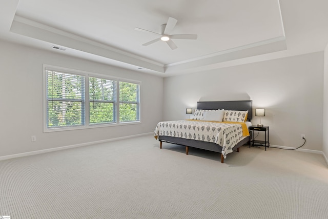 712 Paxton Rose Dr, Greer, SC 29650 - carpeted bedroom with a tray ceiling, baseboards, ornamental molding, and ceiling fan