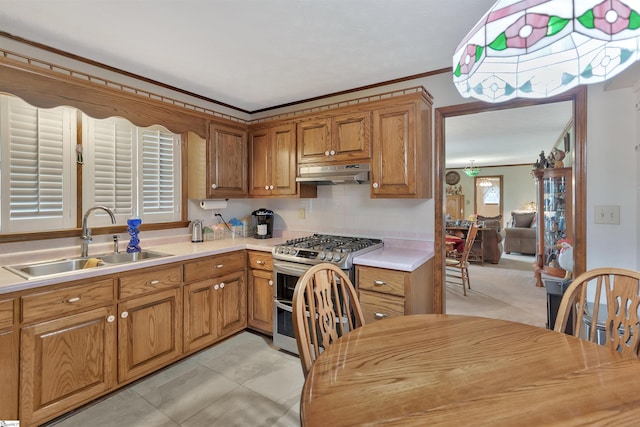 101 Myrtle St, Lavonia, GA 30553 - kitchen featuring double oven range, a sink, under cabinet range hood, brown cabinets, and light countertops