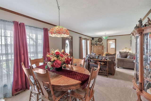 101 Myrtle St, Lavonia, GA 30553 - dining room featuring light colored carpet, ornamental molding, and plenty of natural light