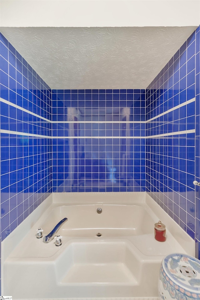 101 Myrtle St, Lavonia, GA 30553 - full bath with tile walls, a bath, and a textured ceiling