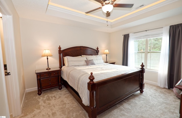 314 Hallie Olivia Dr, Inman, SC 29349 - bedroom with a tray ceiling, light carpet, baseboards, ornamental molding, and a ceiling fan