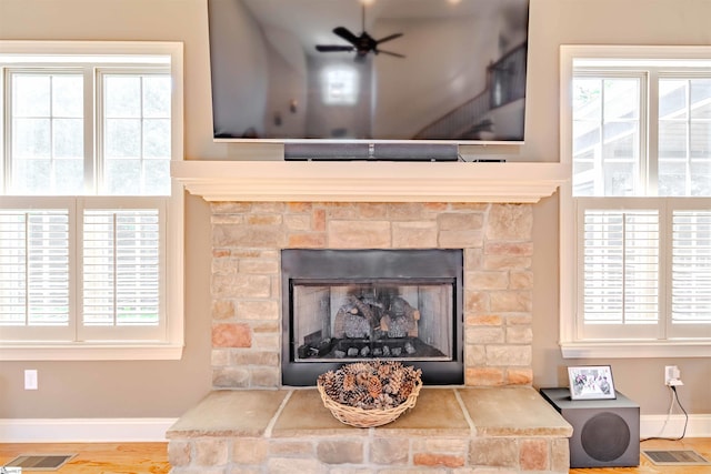 9 Windswept Knoll Dr, Taylors, SC 29687 - detailed view of a fireplace, baseboards, wood finished floors, and a ceiling fan