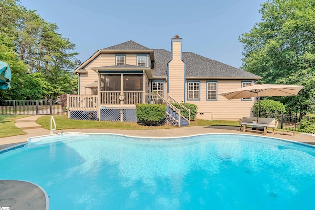 9 Windswept Knoll Dr, Taylors, SC 29687 - view of swimming pool featuring a sunroom and a wooden deck