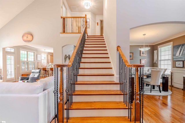 9 Windswept Knoll Dr, Taylors, SC 29687 - stairs featuring arched walkways, wood finished floors, and crown molding
