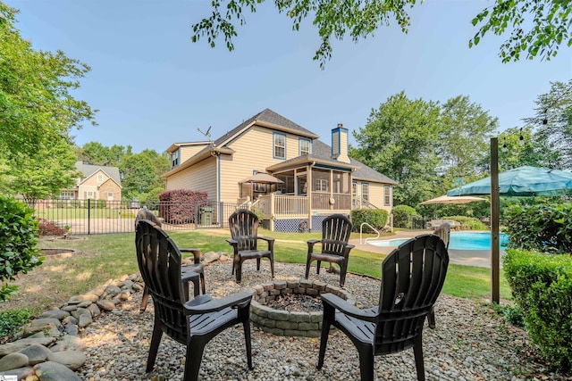 9 Windswept Knoll Dr, Taylors, SC 29687 - rear view of property with an outdoor fire pit, a sunroom, a chimney, and a wooden deck