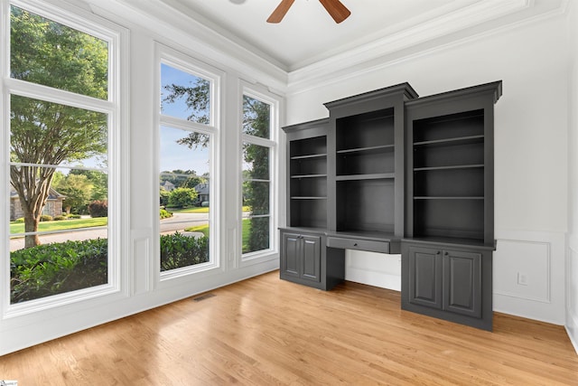 601 Brixton Cir, Simpsonville, SC 29681 - unfurnished office featuring a ceiling fan, crown molding, plenty of natural light, built in study area, and light wood-style floors