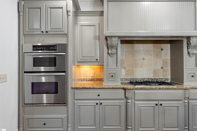 601 Brixton Cir, Simpsonville, SC 29681 - kitchen featuring stainless steel appliances, decorative backsplash, and light stone countertops