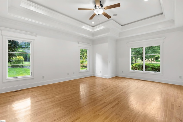 601 Brixton Cir, Simpsonville, SC 29681 - empty room with a ceiling fan, ornamental molding, a tray ceiling, light wood finished floors, and recessed lighting