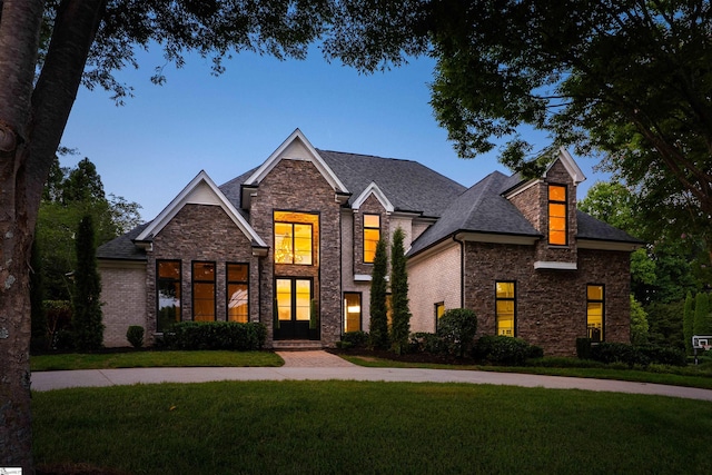 601 Brixton Cir, Simpsonville, SC 29681 - view of front of house featuring a front yard, stone siding, and a shingled roof