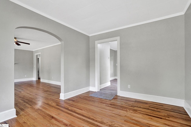 503 Davidson St, Clinton, SC 29325 - unfurnished room with arched walkways, ornamental molding, light wood finished floors, ceiling fan, and baseboards