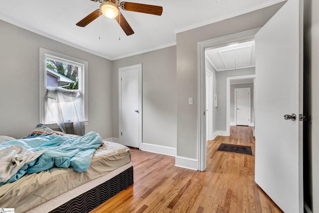 503 Davidson St, Clinton, SC 29325 - bedroom featuring attic access, light wood-type flooring, ornamental molding, baseboards, and a ceiling fan
