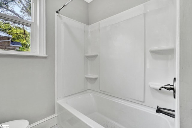 503 Davidson St, Clinton, SC 29325 - bathroom with shower / bath combination, baseboards, and toilet
