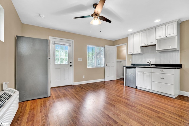 503 Davidson St, Clinton, SC 29325 - kitchen featuring stainless steel appliances, ceiling fan, dark countertops, light wood-type flooring, and recessed lighting