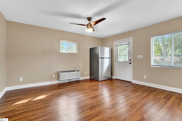 503 Davidson St, Clinton, SC 29325 - unfurnished living room featuring plenty of natural light, wood finished floors, and baseboards