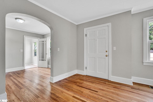 503 Davidson St, Clinton, SC 29325 - entryway featuring arched walkways, light wood finished floors, crown molding, and baseboards