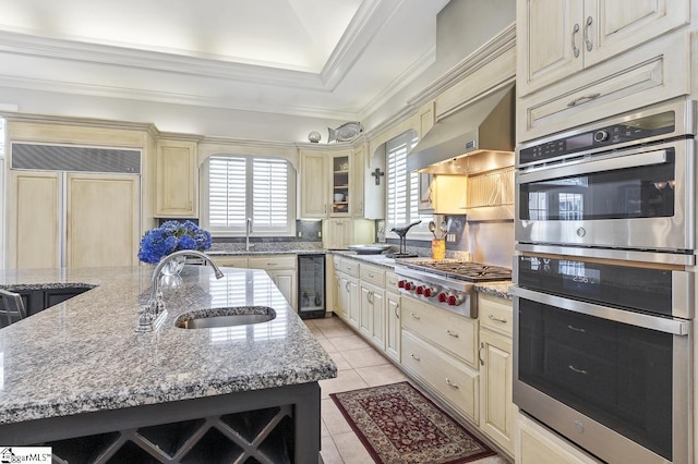33 Southview Ledge Rd, Landrum, SC 29356 - kitchen featuring cream cabinets, stainless steel appliances, a sink, wine cooler, and light tile patterned flooring
