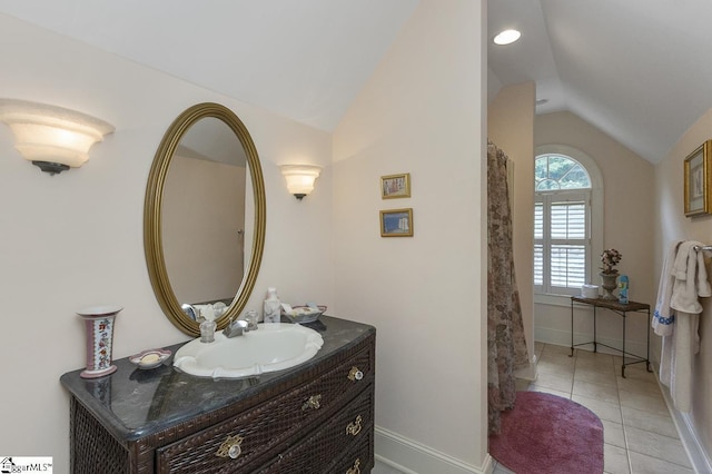 33 Southview Ledge Rd, Landrum, SC 29356 - full bath with vaulted ceiling, vanity, baseboards, and tile patterned flooring