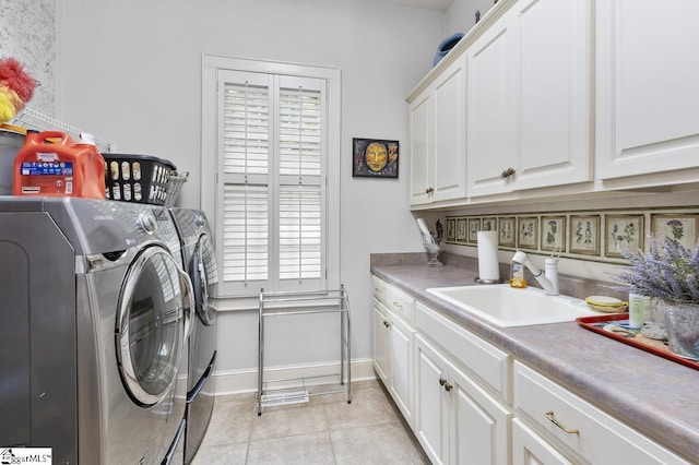 33 Southview Ledge Rd, Landrum, SC 29356 - laundry area featuring cabinet space, independent washer and dryer, light tile patterned floors, baseboards, and plenty of natural light