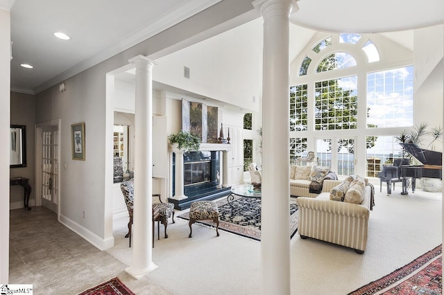 33 Southview Ledge Rd, Landrum, SC 29356 - living area featuring a towering ceiling, ornate columns, baseboards, a glass covered fireplace, and recessed lighting