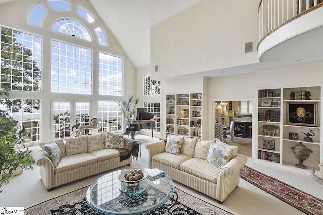 33 Southview Ledge Rd, Landrum, SC 29356 - living area featuring high vaulted ceiling, healthy amount of natural light, and carpet flooring
