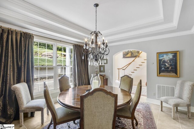 33 Southview Ledge Rd, Landrum, SC 29356 - dining room featuring a raised ceiling, arched walkways, stairway, a chandelier, and crown molding