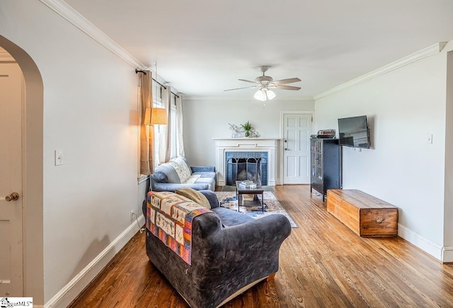 6913 White Horse Rd, Greenville, SC 29611 - living room with arched walkways, ceiling fan, wood finished floors, ornamental molding, and baseboards