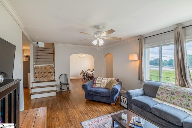 6913 White Horse Rd, Greenville, SC 29611 - living area with arched walkways, stairway, wood finished floors, crown molding, and a ceiling fan