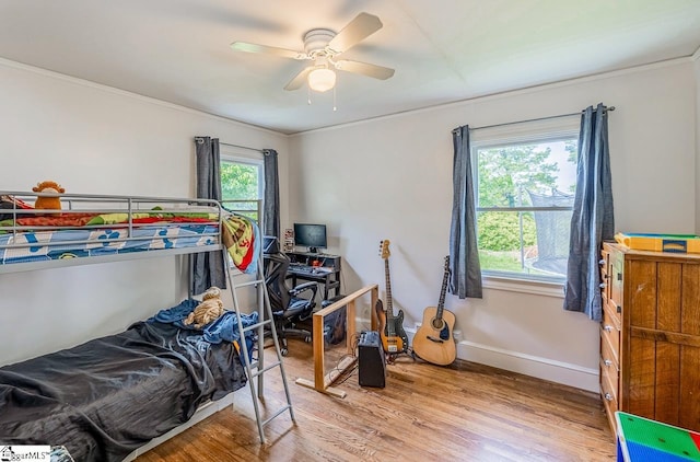 6913 White Horse Rd, Greenville, SC 29611 - bedroom with wood finished floors, crown molding, ceiling fan, and baseboards