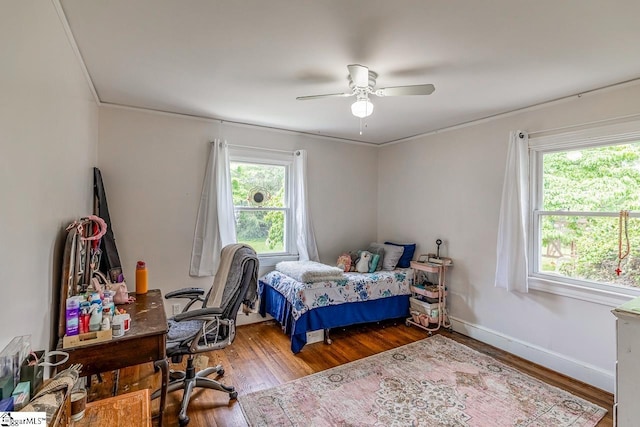 6913 White Horse Rd, Greenville, SC 29611 - bedroom featuring wood finished floors, an office area, crown molding, ceiling fan, and baseboards