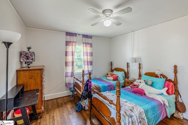6913 White Horse Rd, Greenville, SC 29611 - bedroom with wood finished floors, baseboards, crown molding, and ceiling fan