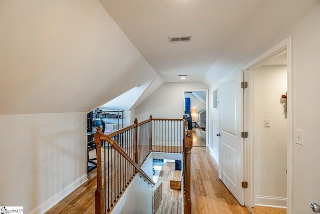 6913 White Horse Rd, Greenville, SC 29611 - hallway with an upstairs landing, light wood-style floors, baseboards, and lofted ceiling