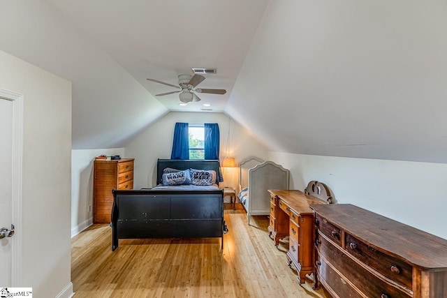 6913 White Horse Rd, Greenville, SC 29611 - bedroom with light wood-style floors, vaulted ceiling, a ceiling fan, and baseboards