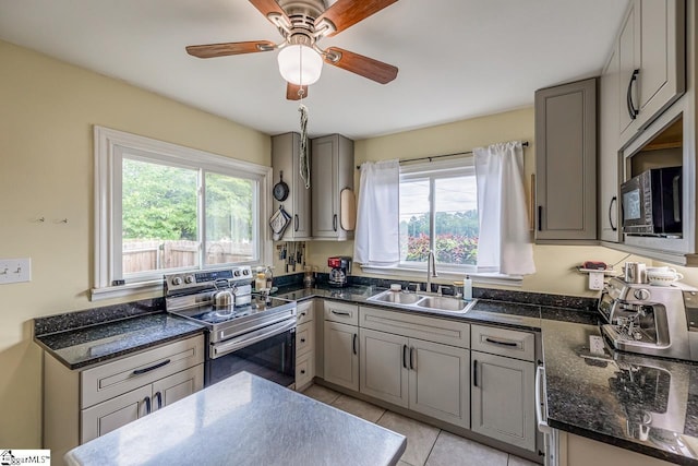 6913 White Horse Rd, Greenville, SC 29611 - kitchen with stainless steel range with electric cooktop, a sink, black microwave, and gray cabinets