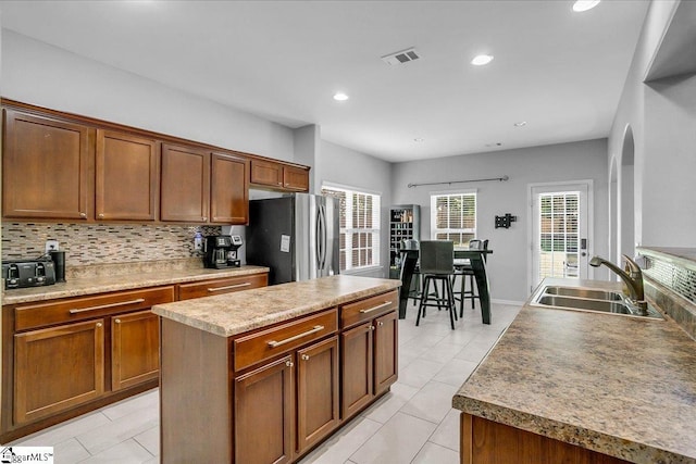102 Eagle Pass Dr, Taylors, SC 29687 - kitchen with a sink, freestanding refrigerator, backsplash, light tile patterned flooring, and recessed lighting