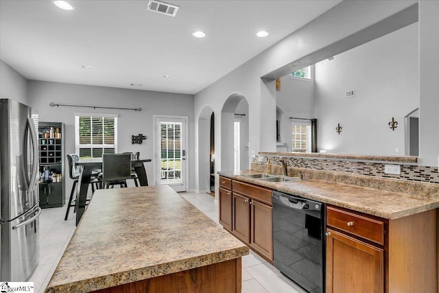 102 Eagle Pass Dr, Taylors, SC 29687 - kitchen with dishwasher, freestanding refrigerator, arched walkways, healthy amount of natural light, and recessed lighting