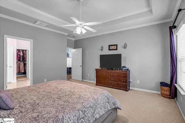 102 Eagle Pass Dr, Taylors, SC 29687 - carpeted bedroom with a walk in closet, baseboards, crown molding, a ceiling fan, and a closet