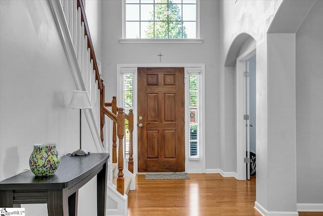 102 Eagle Pass Dr, Taylors, SC 29687 - foyer featuring stairway, light wood-style flooring, a high ceiling, and baseboards